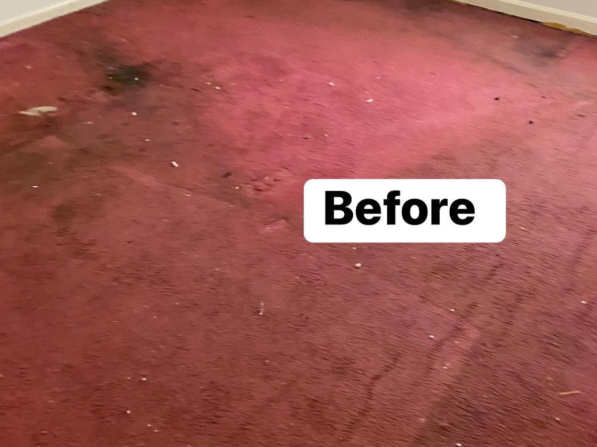 Red bedroom carpet before cleaning